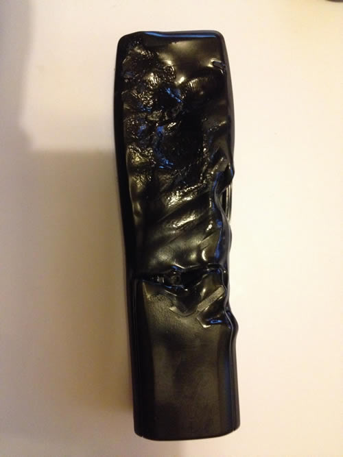 back of the badly burned remote